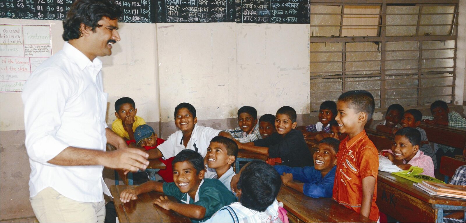 Santosh Talaghatti speaking directly with students in a founding-program classroom in India.